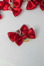 Load image into Gallery viewer, Red satin bow hair ties with rhinestone hearts on crisp white background