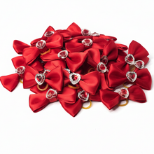 Load image into Gallery viewer, Red satin bows with rhinestone hearts on white background
